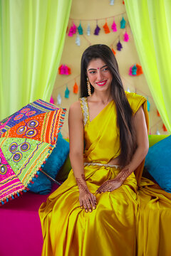 Indian bride sitting on stage during haldi ceremony