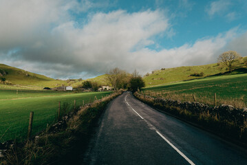 landscape with road and clouds and blue sky