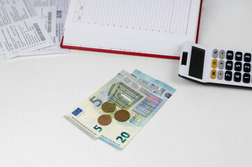 Fototapeta premium Euro money and calculator on a white table.