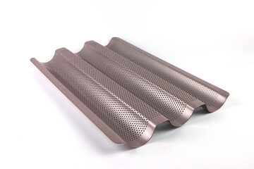 champagne color baguette bread tray is on the white clean table during making homemade butter bread...