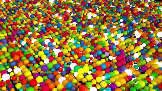 Colorful 3d render bubbles of various sizes fall and rush along surface. Multicolored balls in geometric layering of digital fun interior. Realistic childrens decor with plastic and glass.
