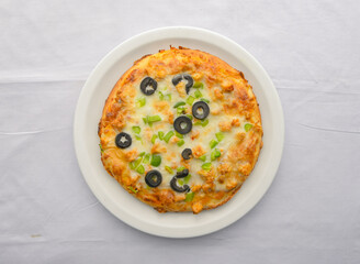 Chicken Fajita Pizza isolated on wooden background, spiced chicken cubes and cheese combination on bread, Italian food top view