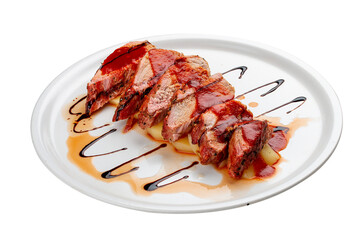 Pork tenderloin on baked potatoes with sauce. Isolated on a white background