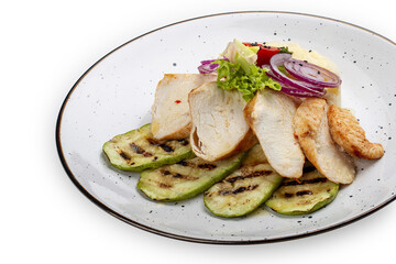 Baked chicken fillet on a pillow of mashed potatoes. Isolated on a white background.