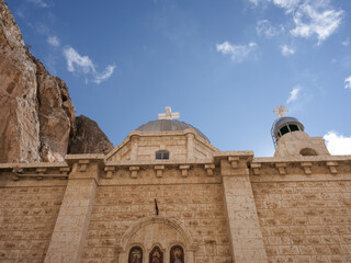 SYRIA. Maalul Monastery is located 60 km from Damascus. Nearby is the village of Kalamondin resembling an eagle's nest. The houses are built on the rocks by steps.