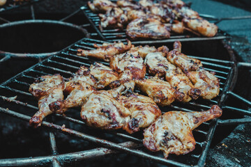 fried chicken cooking on a hot rock