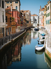 Fototapeta na wymiar boats on channels of Venice Italy