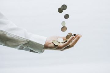 coins fall into the hand