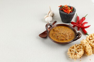 Fototapeta premium Sambal Tumpang Kediri, Traditional Food from Kediri, East Java, Indonesia. Made of Tempeh, Herbs and Spices. Copy Space for Text