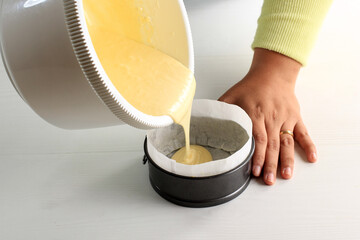Pour Cake  Mixture to the Prepared Baking Pan. Step by Step Baking On Bakery Concept, White Background