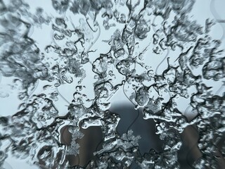 melting ice on the window macro