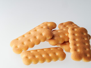 Crushed cracker and crumbs on white background