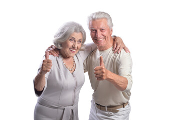 Happy senior couple with thumbs up on white background