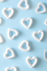 White hearts on a blue background. Minimal aesthetic love valentines wallpaper.