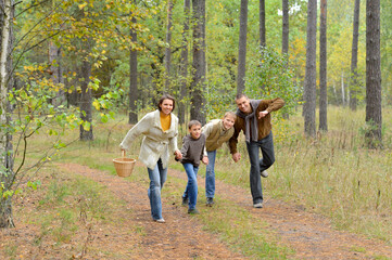 Portrait of family of four in park