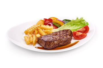 Grilled barbecue beef steak with vegetables, close-up, isolated on white background.