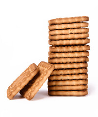 Stack of shortbread cookies baked milk and two cookies leaning against a stack, photographed against a white background