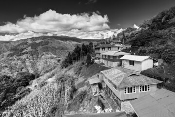 Okhrey village, Himalayan mountain range in the background . Okhrey is a remote village with breathtaking scenic natural vista of world famous Himalayas in background, in Sikkim, India.
