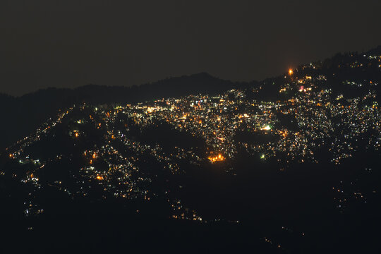 Beautiful night image of Darjeeling, Queen of Hills, as seen from Okhrey, Sikkim, India