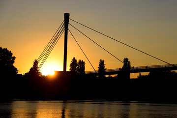 silhouette of a pedestrian bridge over Sava River, Serbia