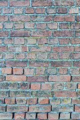 old stone wall made of weathered bricks as background