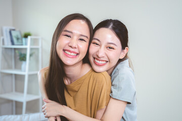 two happy women lesbian couple living together