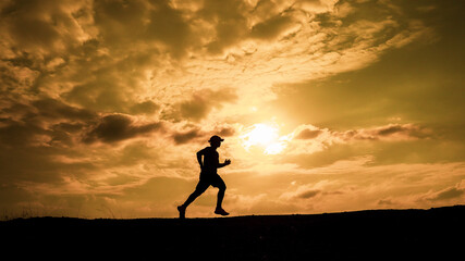 men's silhouette I am jogging to stay healthy in the evening. Men exercise by running. health care concept