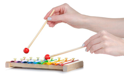 children toy xylophone in hand on white background isolation