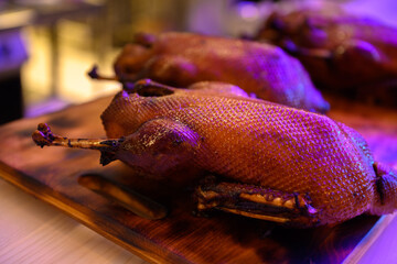 Duck baked on a wooden board