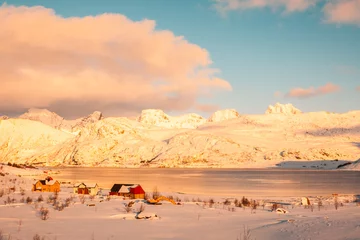 Foto op Canvas Seaside town with huge snow-capped mountains in the background in the arctic circle © Javier
