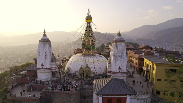 Swayambhunath Stupa in Kathmandu Nepal flying in closer to the religious complex.