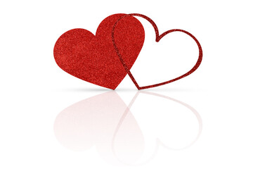 two glittering red hearts on a white glossy background. Valentine's Day