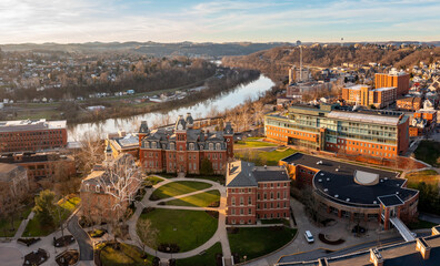 Aerial drone panoramic shot of the downtown campus of WVU in Morgantown West Virginia showing the...
