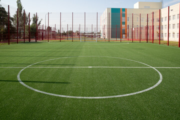 Obraz premium New soccer field with fencing