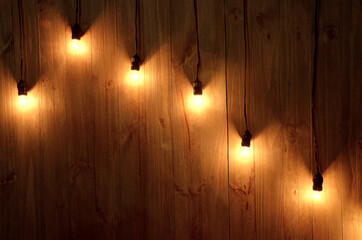 wooden wall with exposed lamps