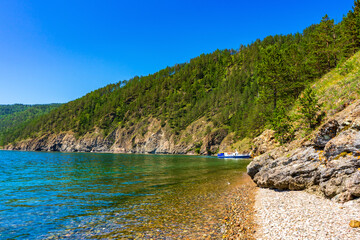Great Baikal Trail. Popular route along lake Baikal shore from Listvyanka to Big Koty. Lake Baikal coast, hill with forest, water bay. Summer travel, discovery of beauty of Earth. Siberia, Russia © Tatyana_Andreyeva