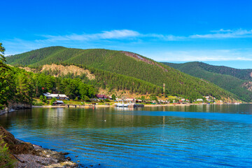 Great Baikal Trail. Popular route along lake Baikal shore from Listvyanka. View to Bolshie Koty village at lake Baikal coast, water bay. Summer travel, discovery of beauty of Earth. Siberia, Russia © Tatyana_Andreyeva