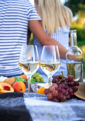 couple in love drinking wine on a picnic. Selective focus