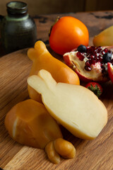 Smoked mozzarella cheese on a wooden table.