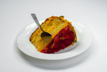 An appetizing piece of sweet cake on a plate. White isolate with cream cake. Non-compliance with the diet.