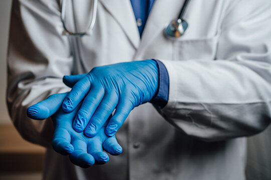 Doctor doing a bribe gesture by rubbing hands