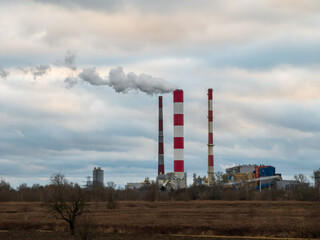 Fototapeta na wymiar the smoking chimneys of the power plant 