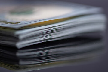 Stack of one hundred American dollars banknotes, close-up.