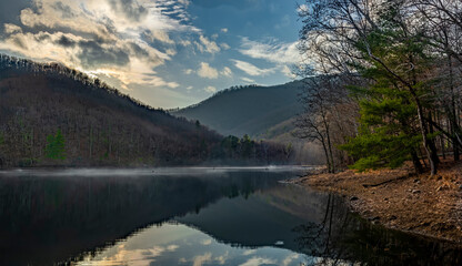 Sunset over the Sugar Hollow Reservoir in winter. Reservoir is source of water for Charlottesville, Virginia.