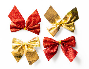 Red and golden shiny festive bow isolated on white background