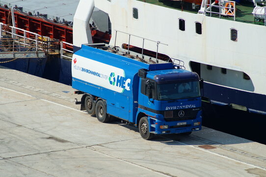 Heraklion Crete, Greece - 23 August 2021: Michalis general cargo ship moored and bunkering oil by H.E.C. in port