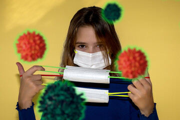 Teenage girl is intimidated by viruses floating around and wears protective masks