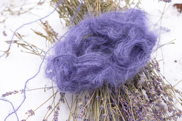 Purple mohair threads and purple lavender on a snow background. Color 2022. Very peri. Lavender...