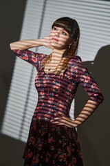Beautiful young woman in a floral dress