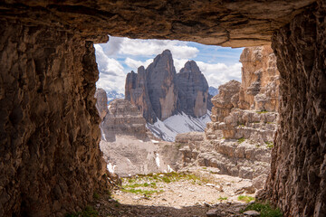 View to Tre Cime di Lavaredo from cave, Dolomites - obrazy, fototapety, plakaty